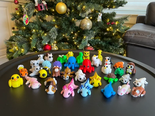A collection of colorful 3D printed mini animals